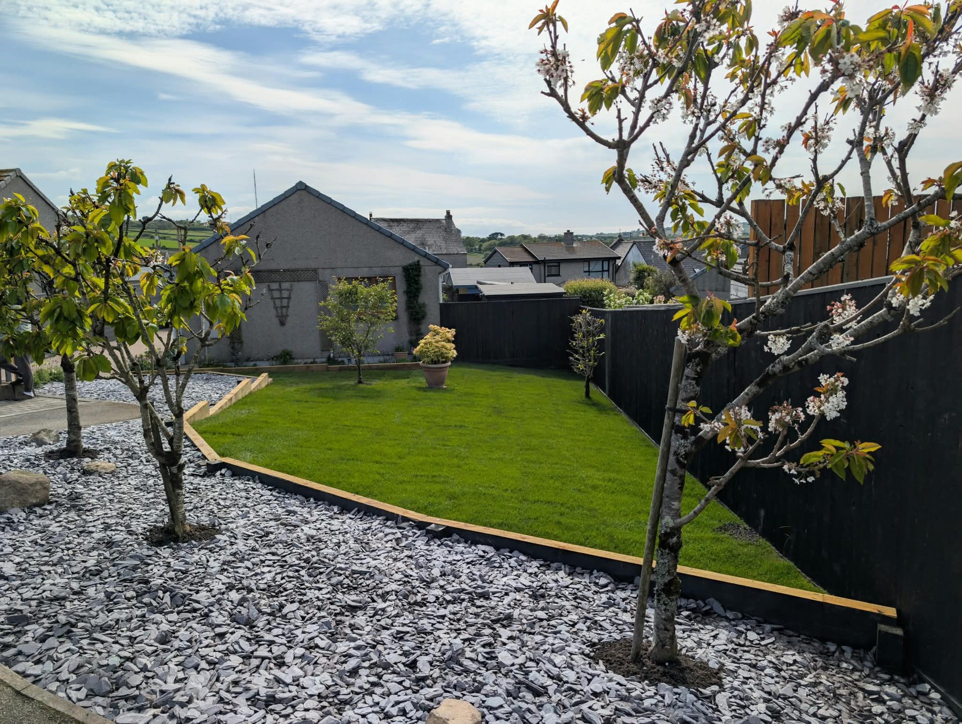 New lawn with slate chip borders and timber edging in a Cornwall front garden
